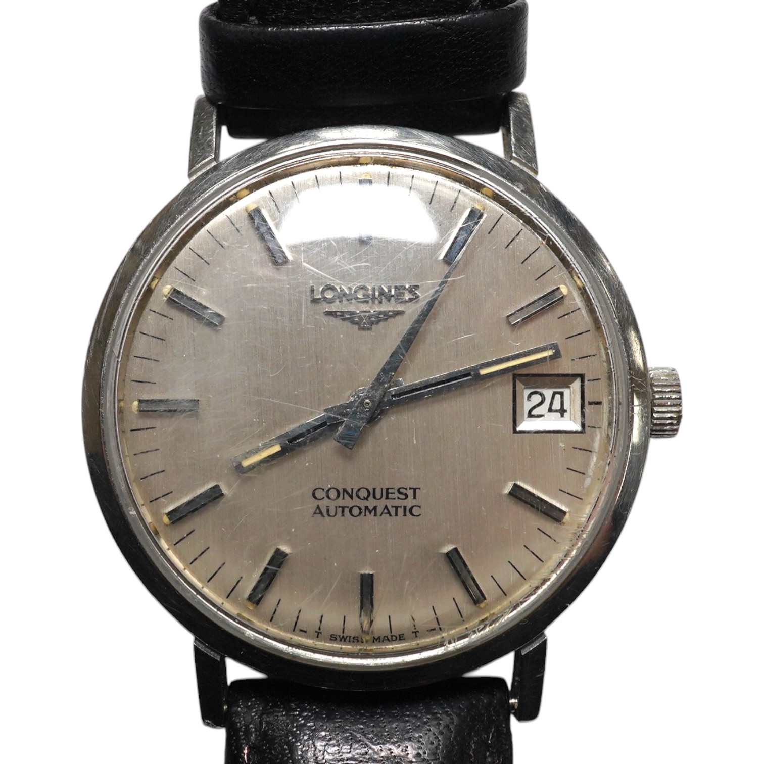 A gentleman's stainless steel Longines Conquest Automatic wrist watch, on an associated leather strap, case diameter 35mm. Condition - poor to fair